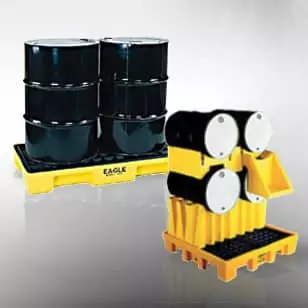 secondary-containment_lg Two sets of black industrial barrels: one on a yellow pallet with the label "Eagle," and another stacked on a yellow containment platform. The barrels are arranged in a 2x2 configuration and a vertical stack.